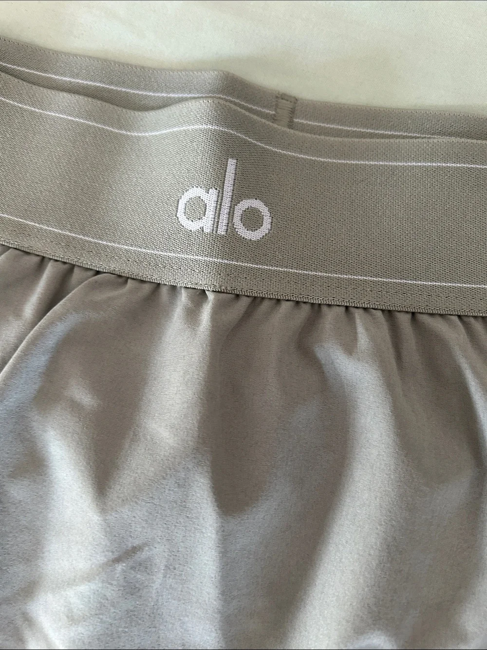 ALO Yoga match point tennis skirt in dune grass color
